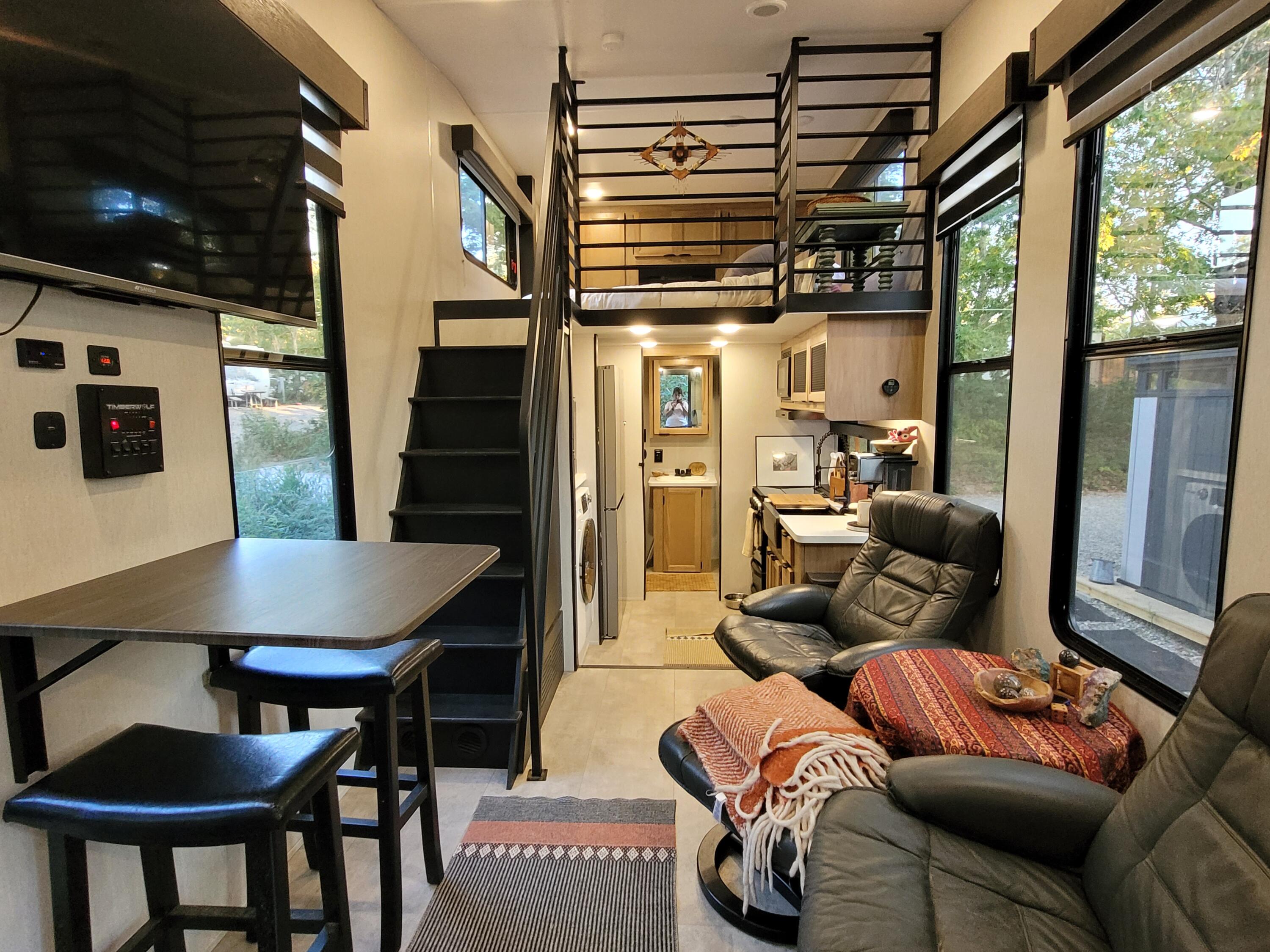 71 South Highland Road, Unit 235 Truro, MA 02666 - Photo 64 of 74 a living room with furniture a flat screen tv and a refrigerator