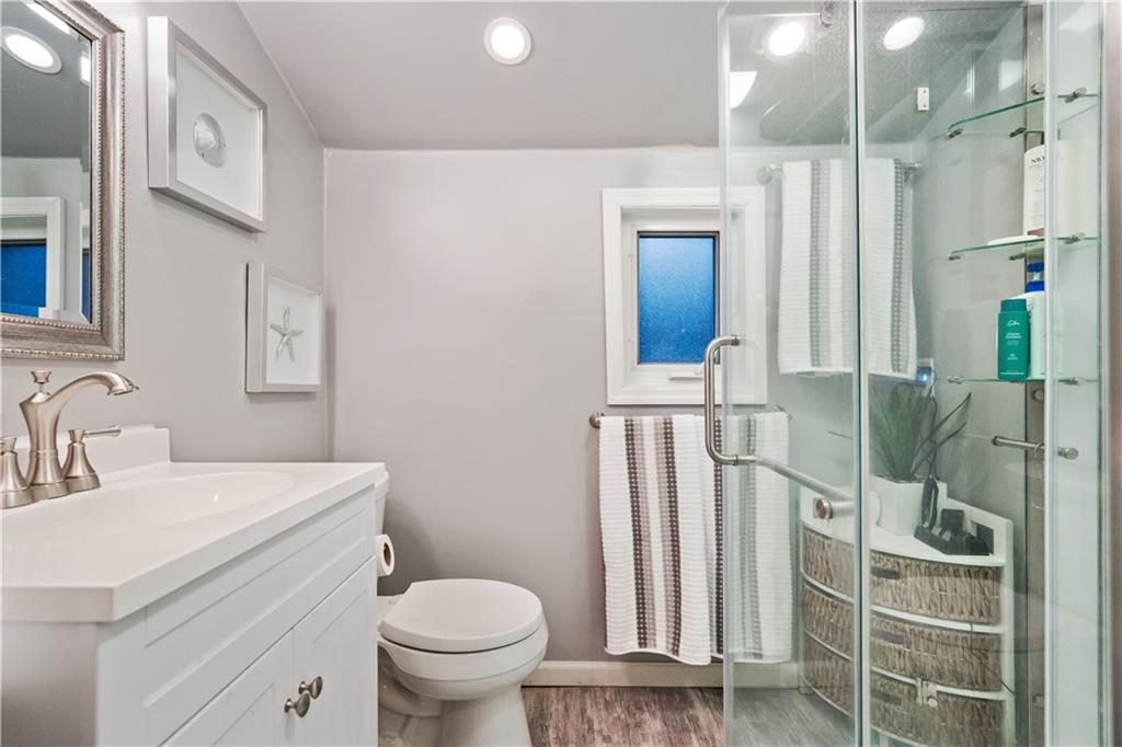 261 Ridge Avenue Pittsburgh, PA 15221 - Photo 14 of 25 a bathroom with a sink a toilet and shower