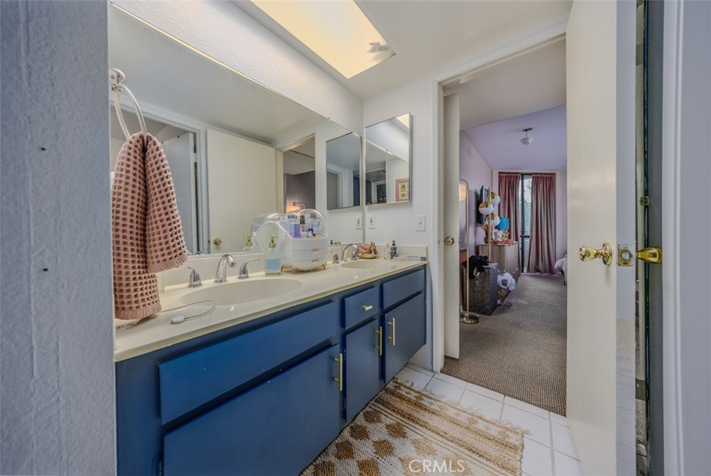 1237 East 6th Street, Unit 110 Long Beach, CA 90802 - Photo 12 of 22 a en suite bathroom with a sink double vanity