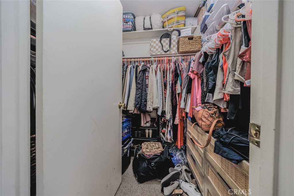 1237 East 6th Street, Unit 110 Long Beach, CA 90802 - Photo 14 of 22 a view of walk in closet with clothes
