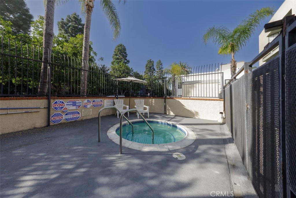 1237 East 6th Street, Unit 110 Long Beach, CA 90802 - Photo 21 of 22 a swimming pool with outdoor seating and plants