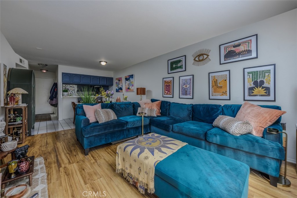 1237 East 6th Street, Unit 110 Long Beach, CA 90802 - Photo 6 of 22 a living room with furniture and view of kitchen