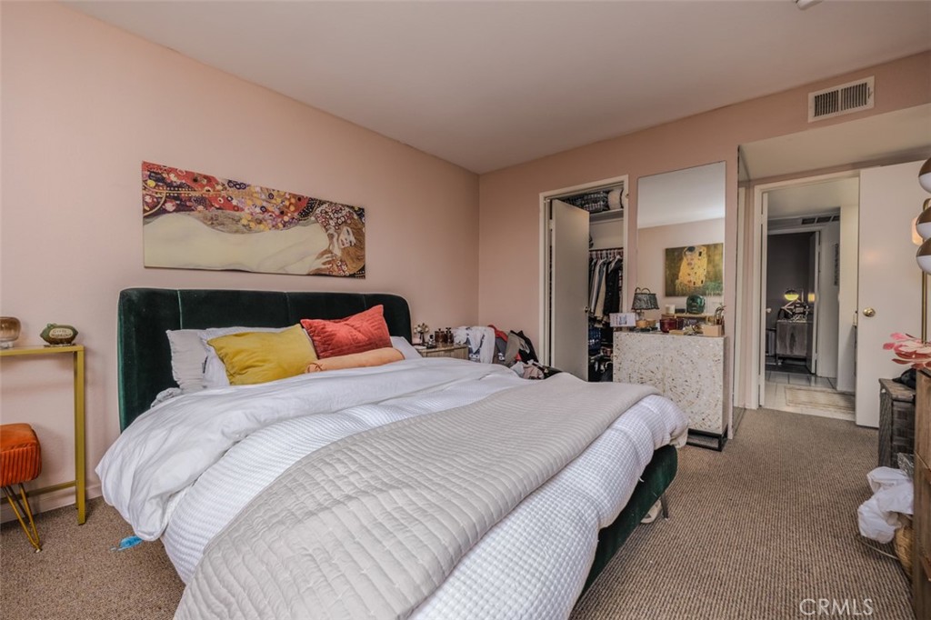 1237 East 6th Street, Unit 110 Long Beach, CA 90802 - Photo 9 of 22 a bedroom with a bed and a view of bathroom