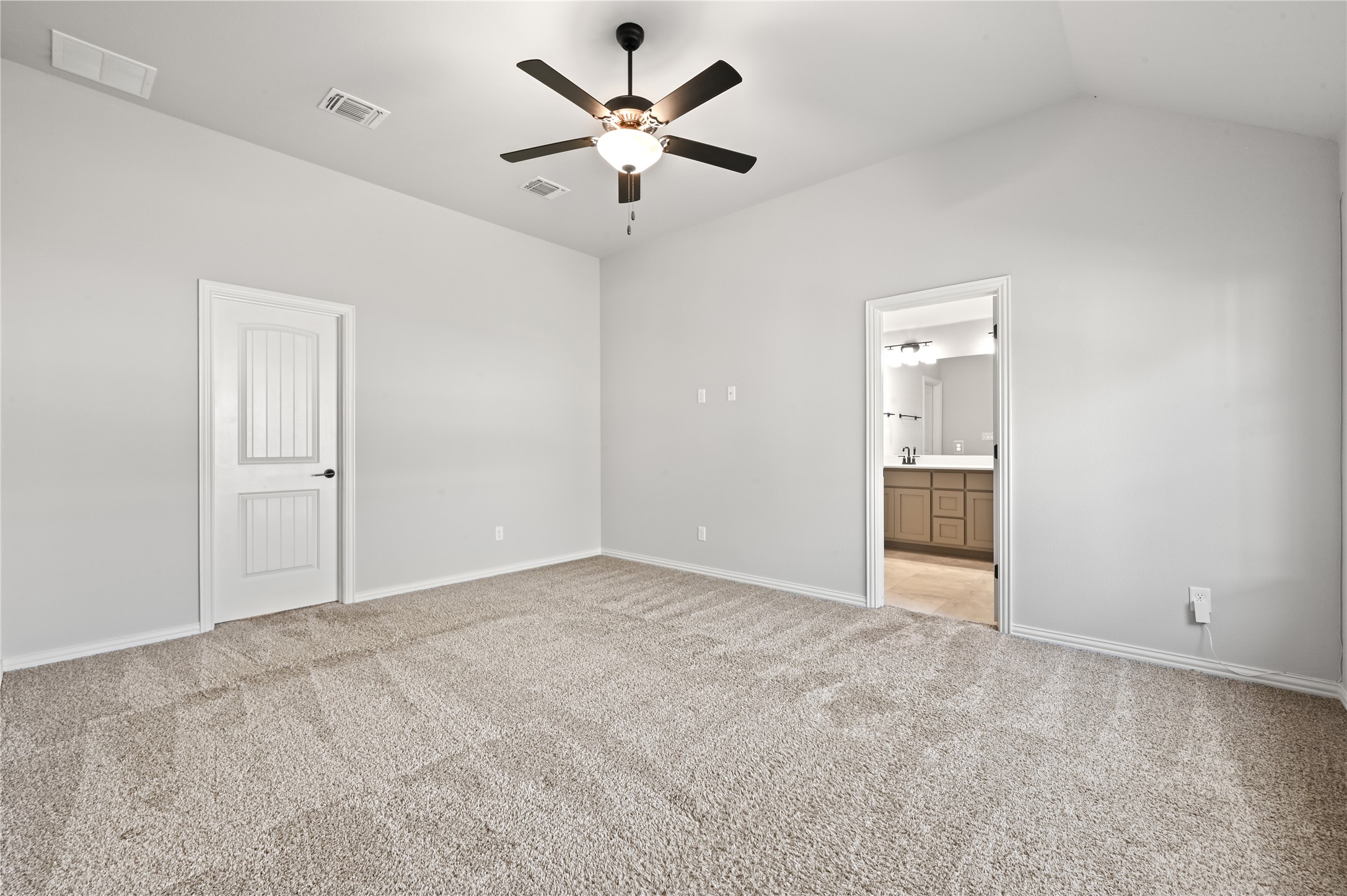 426 Cold Riv Run Kyle, TX 78640 - Photo 16 of 34 A spacious sleeping area with fresh carpeting and direct access to a private washroom.