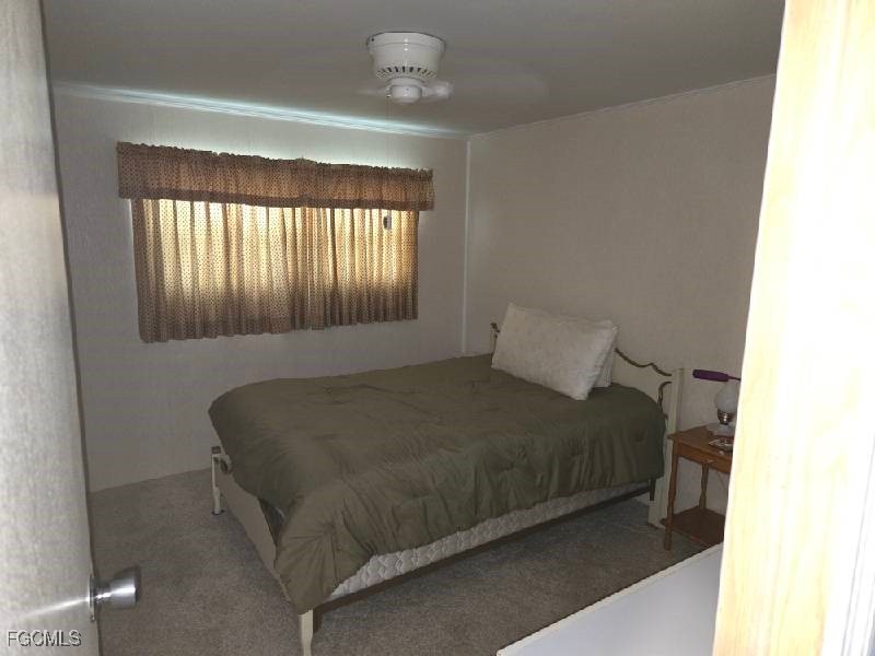 9 Elder Alva, FL 33920 - Photo 5 of 12 a bed sitting in a bedroom next to a window