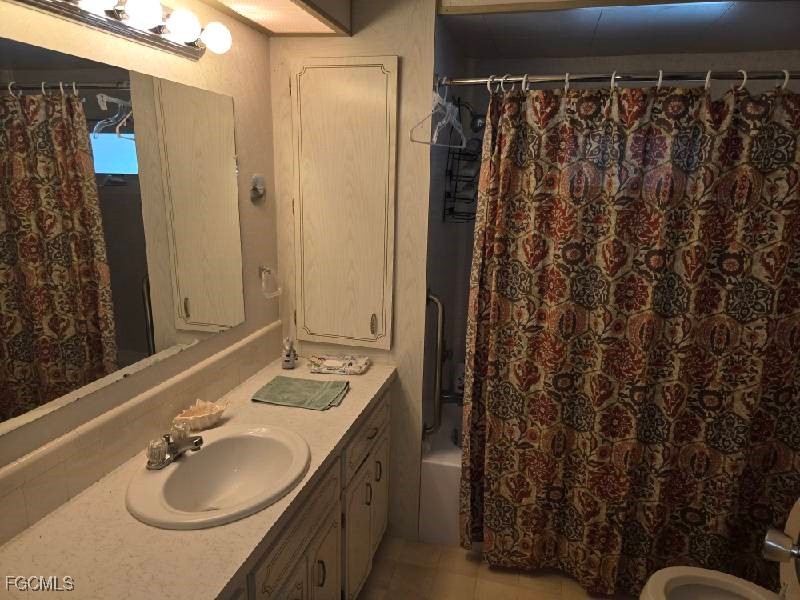 9 Elder Alva, FL 33920 - Photo 6 of 12 a bathroom with a sink and a mirror