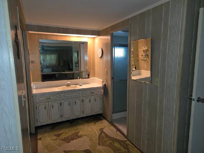 9 Elder Alva, FL 33920 - Photo 8 of 12 a bathroom with double vanity and a mirror