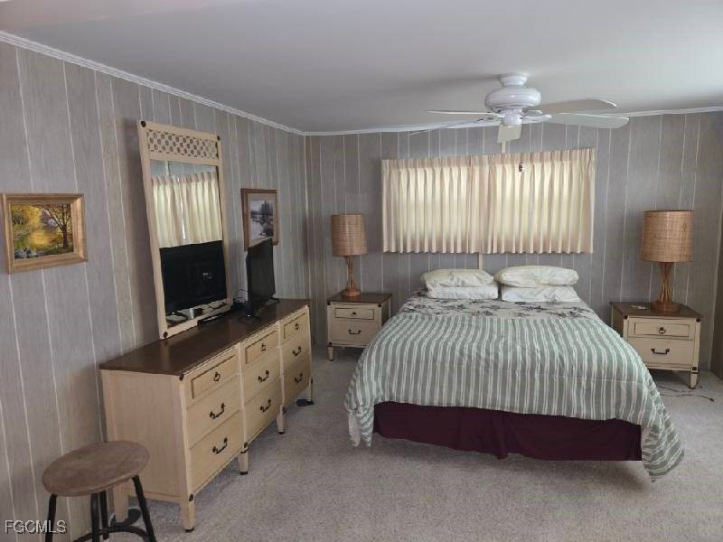 9 Elder Alva, FL 33920 - Photo 10 of 12 a bedroom with a bed and flat tv screen on the dresser