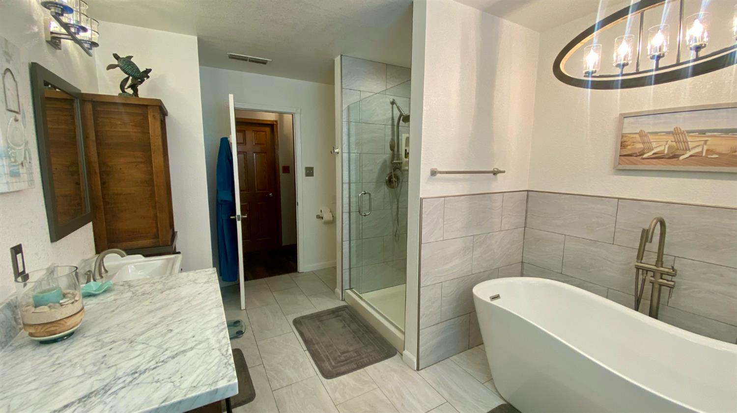5012 Ustick Road Modesto, CA 95358 - Photo 24 of 26 a bathroom with a sink and a mirror