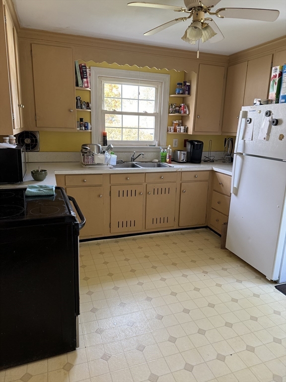 4 Benjamin Road Worcester, MA 01602 - Photo 5 of 10 a kitchen with cabinets a sink and appliances