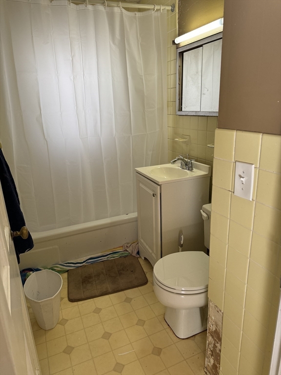 4 Benjamin Road Worcester, MA 01602 - Photo 6 of 10 a bathroom with a toilet and a shower curtain