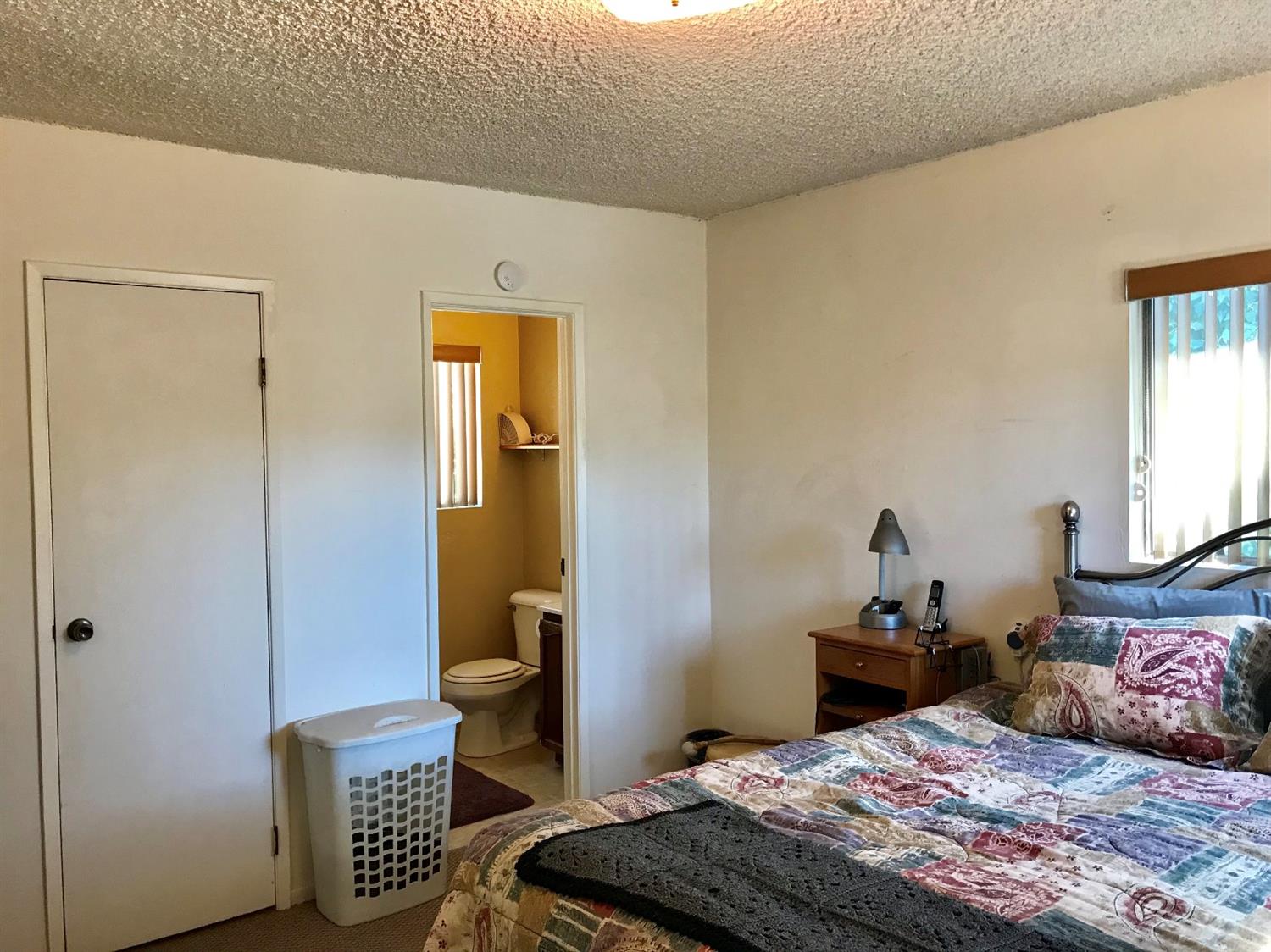 160 Grapevine Road Oak View, CA 93022 - Photo 16 of 35 a bedroom with a bed and wooden floor