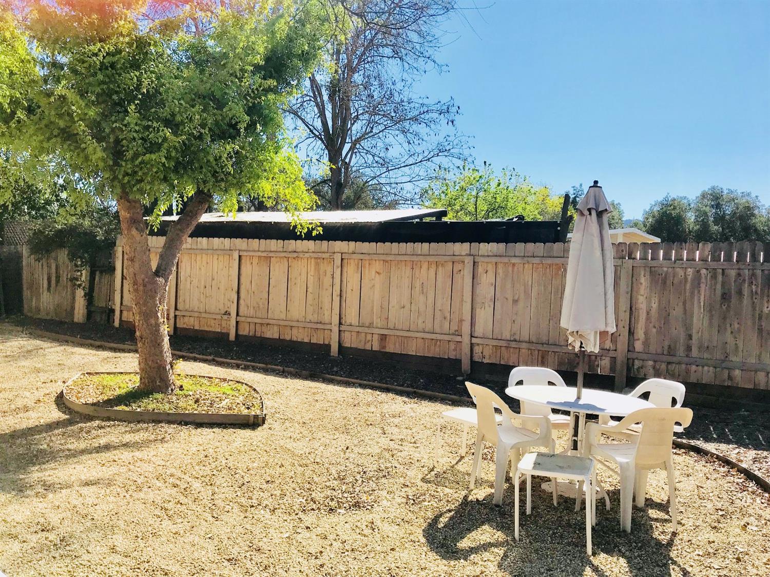 160 Grapevine Road Oak View, CA 93022 - Photo 32 of 35 a view of a chairs and tables in the back yard of the house