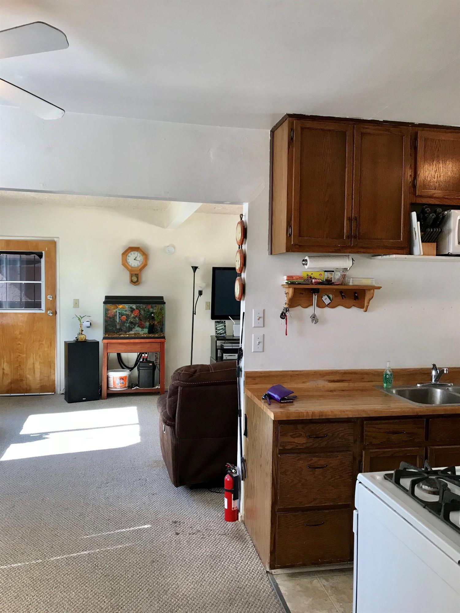 160 Grapevine Road Oak View, CA 93022 - Photo 8 of 35 a kitchen with a refrigerator and a stove top oven