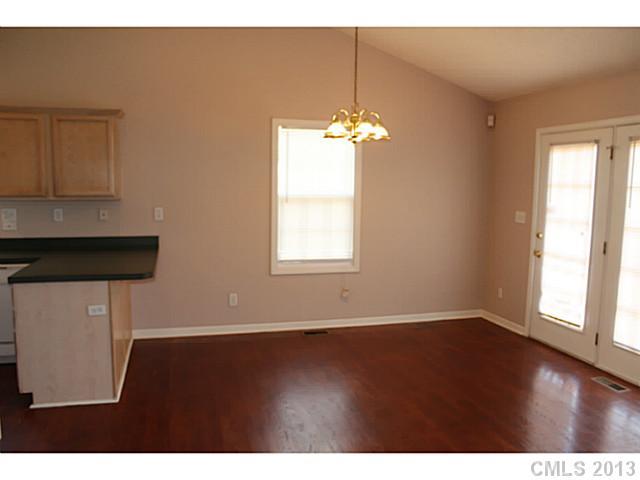 1525 West Ridge Road Salisbury, NC 28147 - Photo 8 of 16 a view of empty room with wooden floor and fan