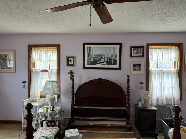 a living room with furniture a window and a fireplace