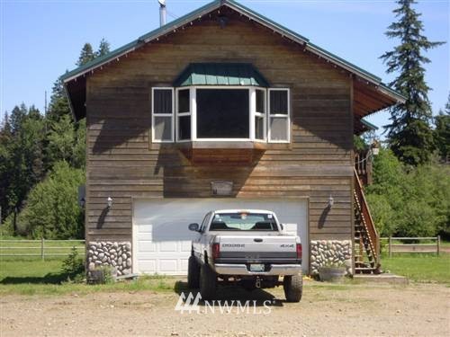 6551 Nelson Siding Road Cle Elum, WA 98922 - Photo 1 of 1 a front view of a house with a yard