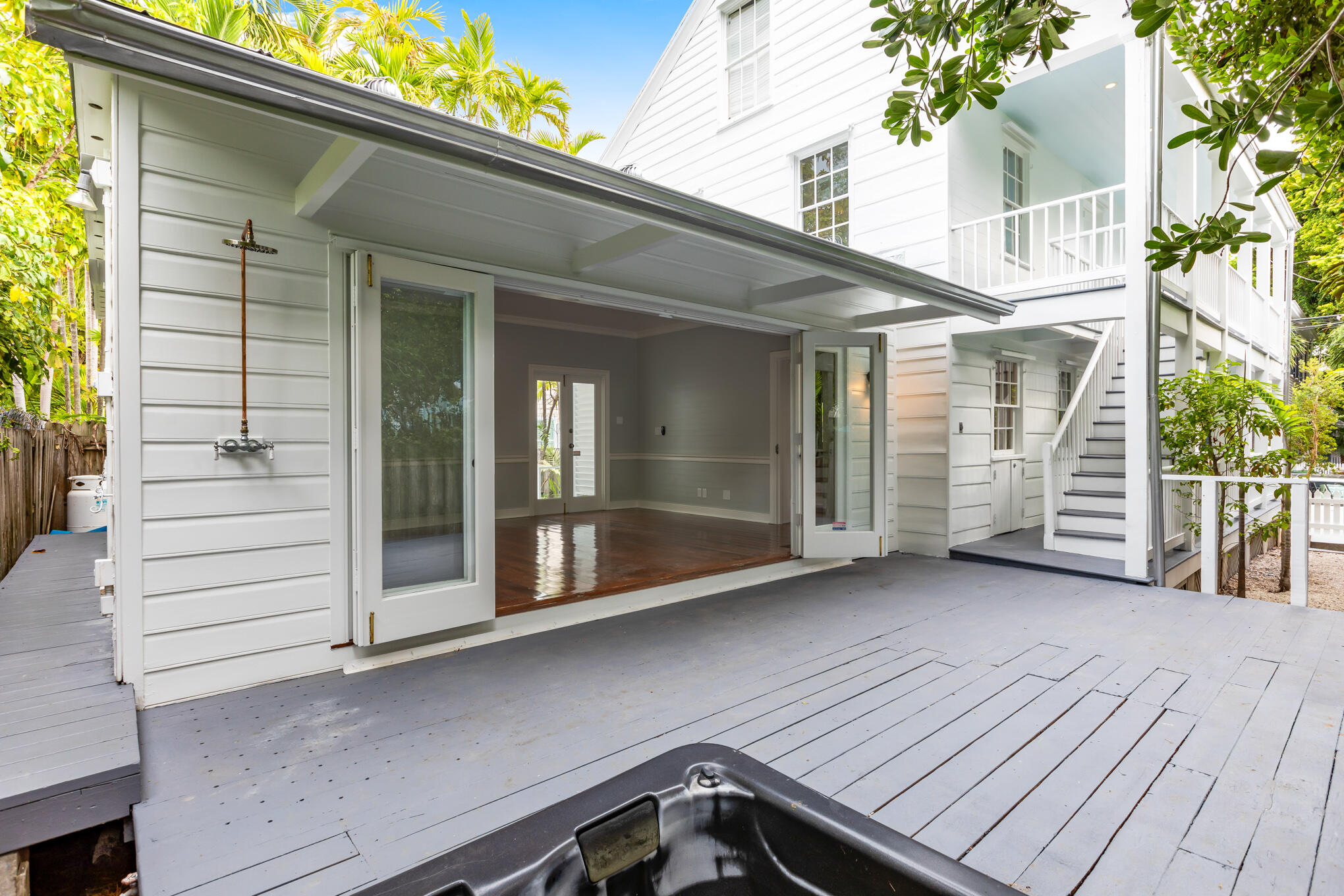 408 William Street Key West, FL 33040 - Photo 19 of 58 a view of a house with a barbeque and wooden stairs