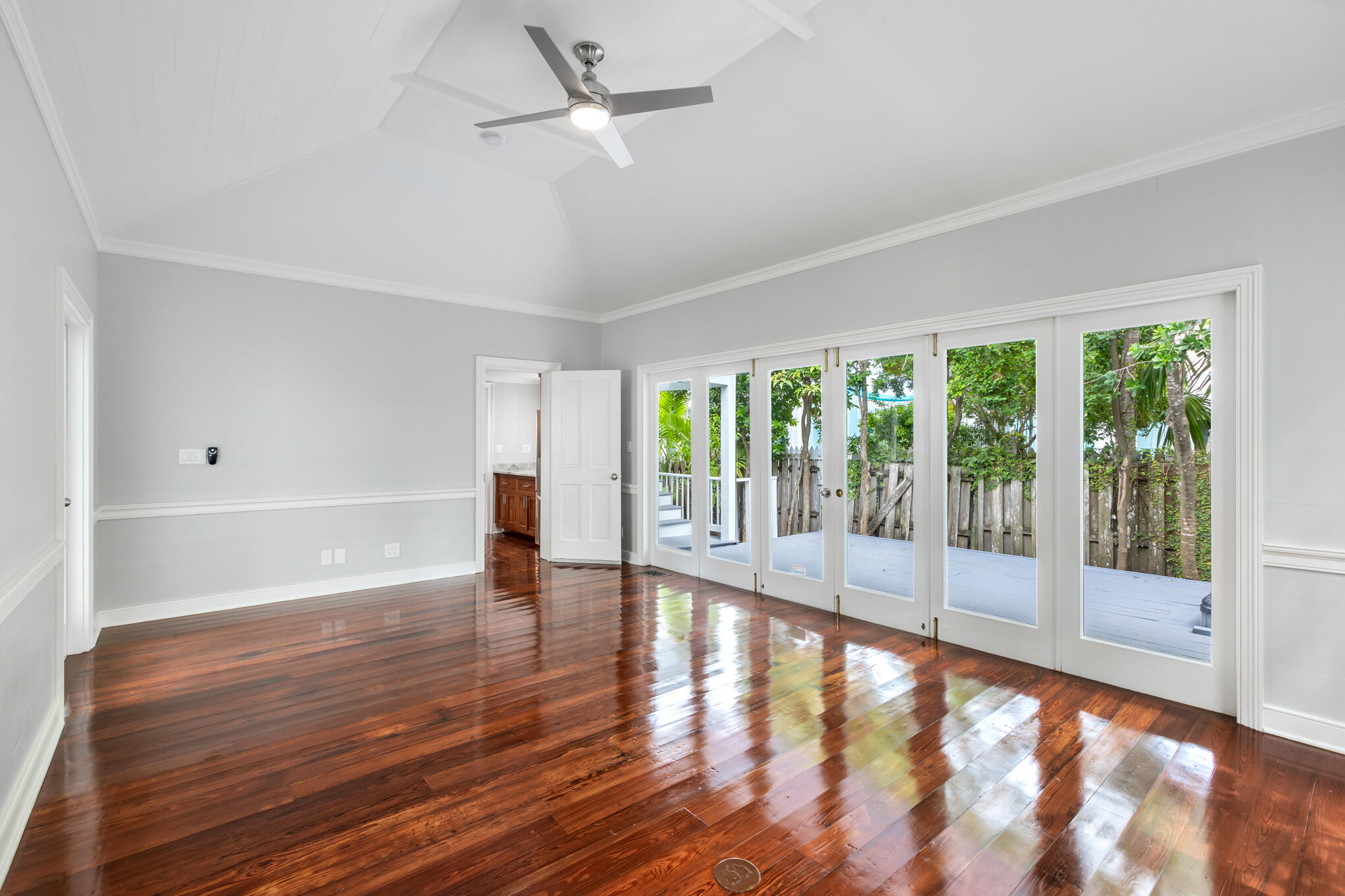 408 William Street Key West, FL 33040 - Photo 30 of 58 a view of empty room with wooden floor and fan