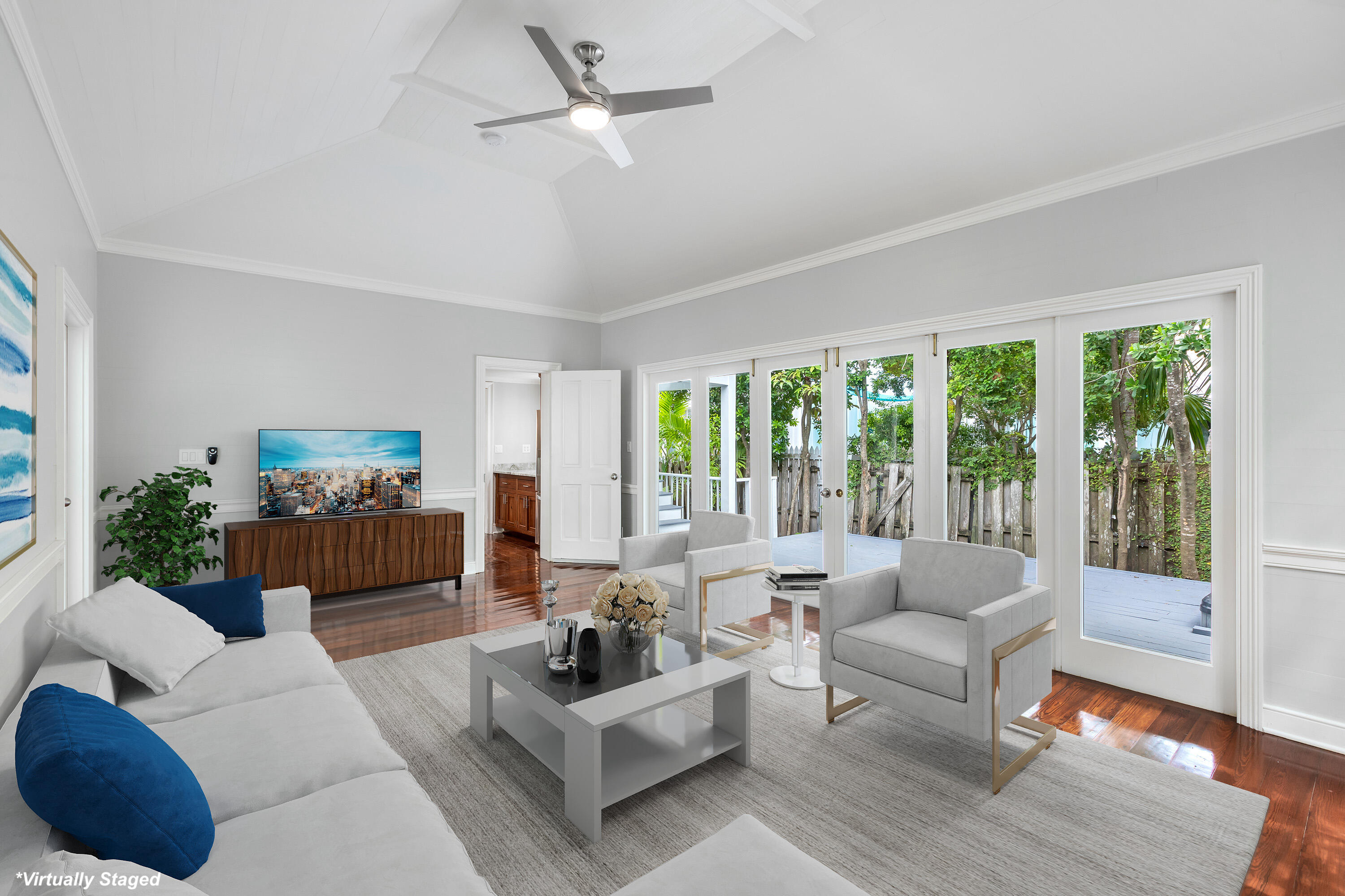 408 William Street Key West, FL 33040 - Photo 31 of 58 a living room with furniture a large window and a flat screen tv