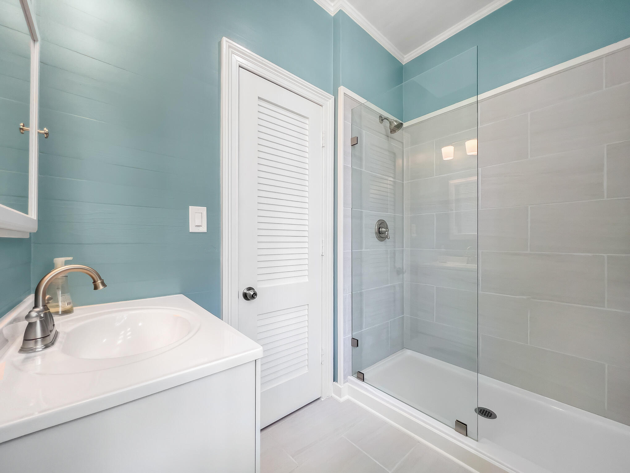 408 William Street Key West, FL 33040 - Photo 35 of 58 a bathroom with a sink and a shower