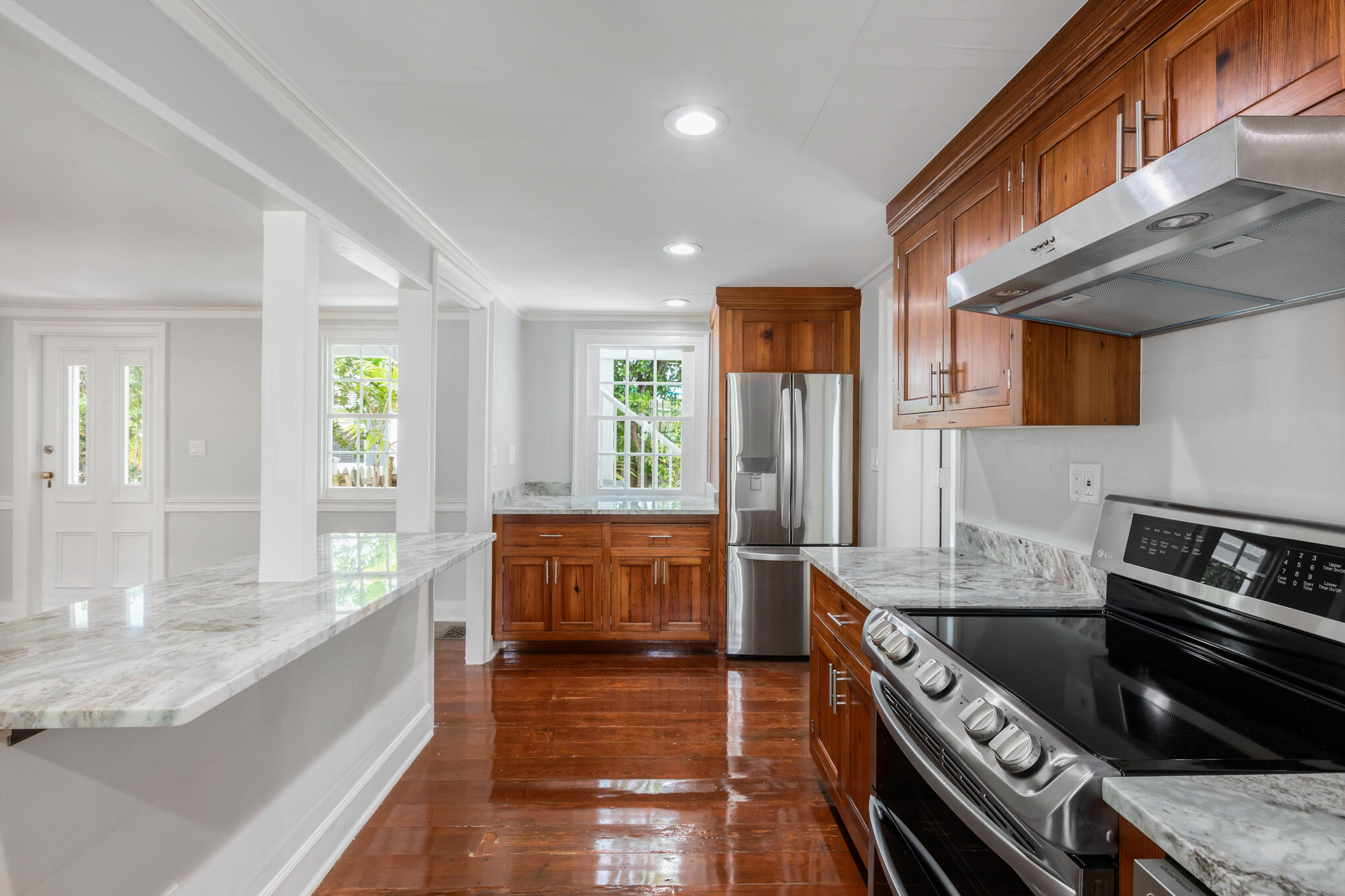 408 William Street Key West, FL 33040 - Photo 4 of 58 a large kitchen with stainless steel appliances granite countertop a stove and a sink
