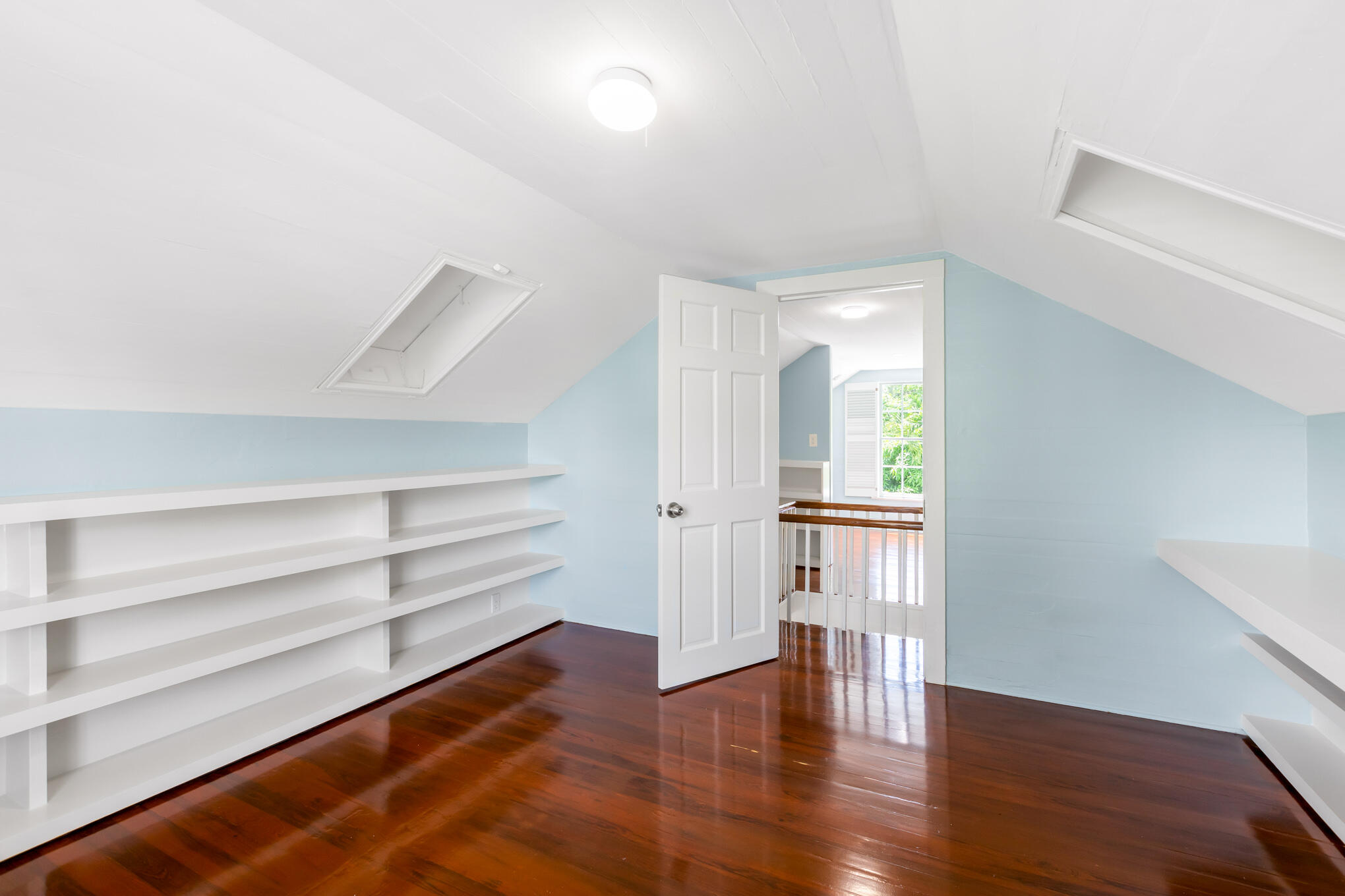 408 William Street Key West, FL 33040 - Photo 46 of 58 a view of empty room with wooden floor and window