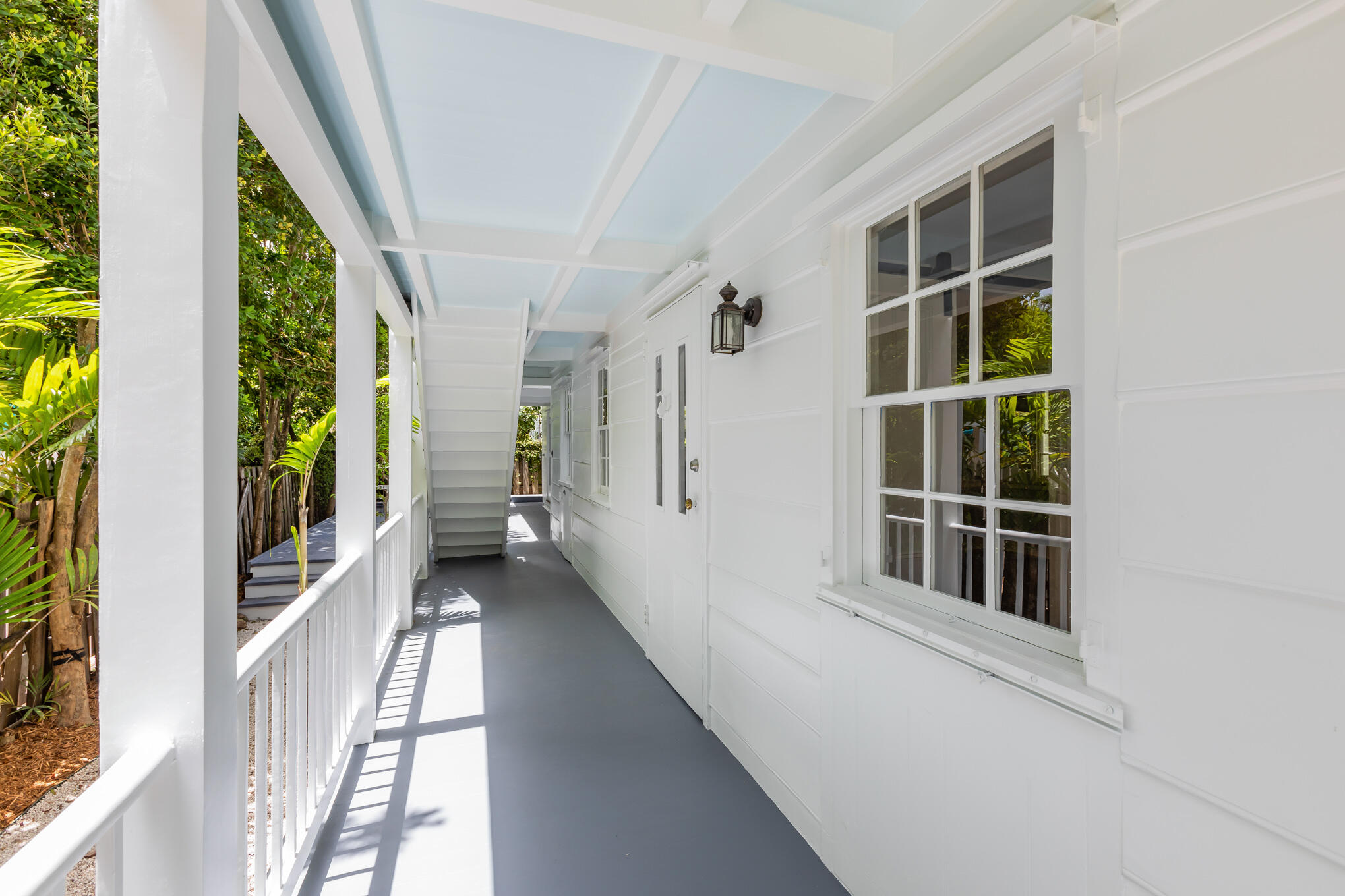 408 William Street Key West, FL 33040 - Photo 56 of 58 a view of a porch with wooden floor and windows