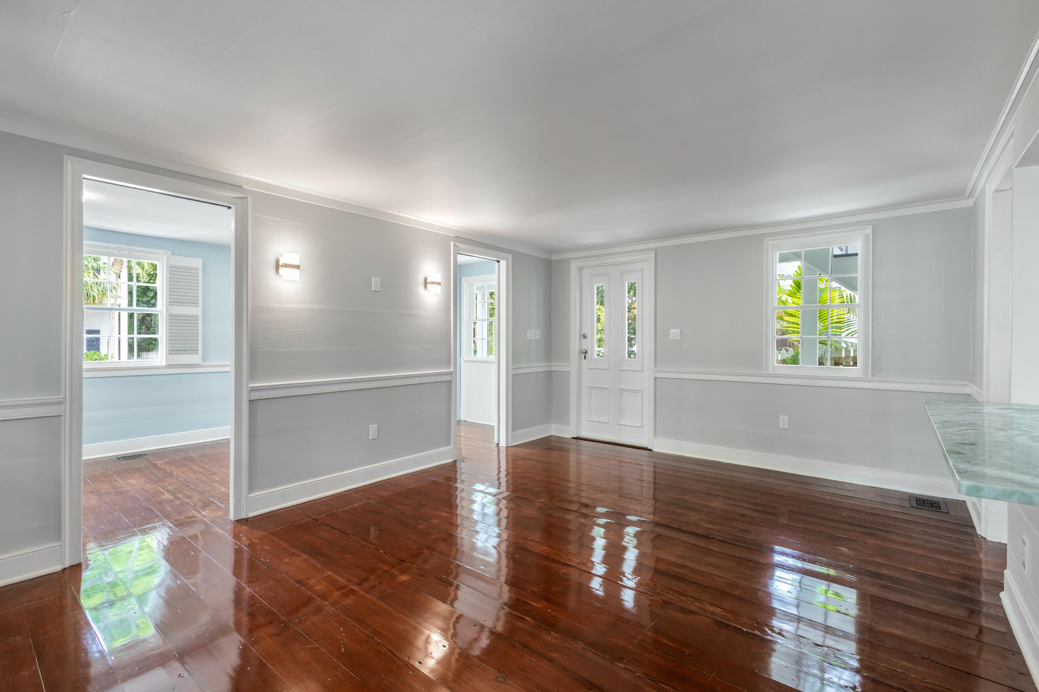408 William Street Key West, FL 33040 - Photo 10 of 58 a view of an empty room with window and wooden floor