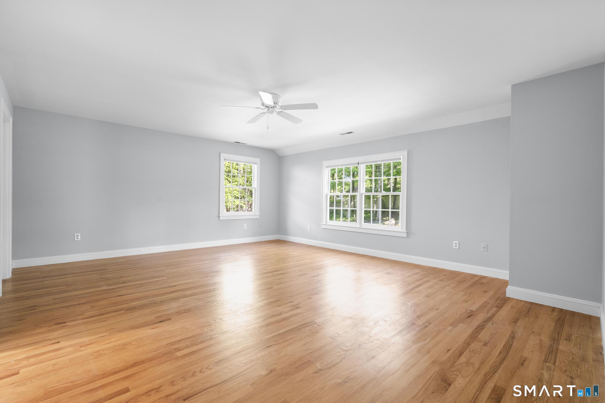 181 Old Branchville Road Ridgefield, CT 06877 - Photo 25 of 40 a view of an empty room with wooden floor and a window