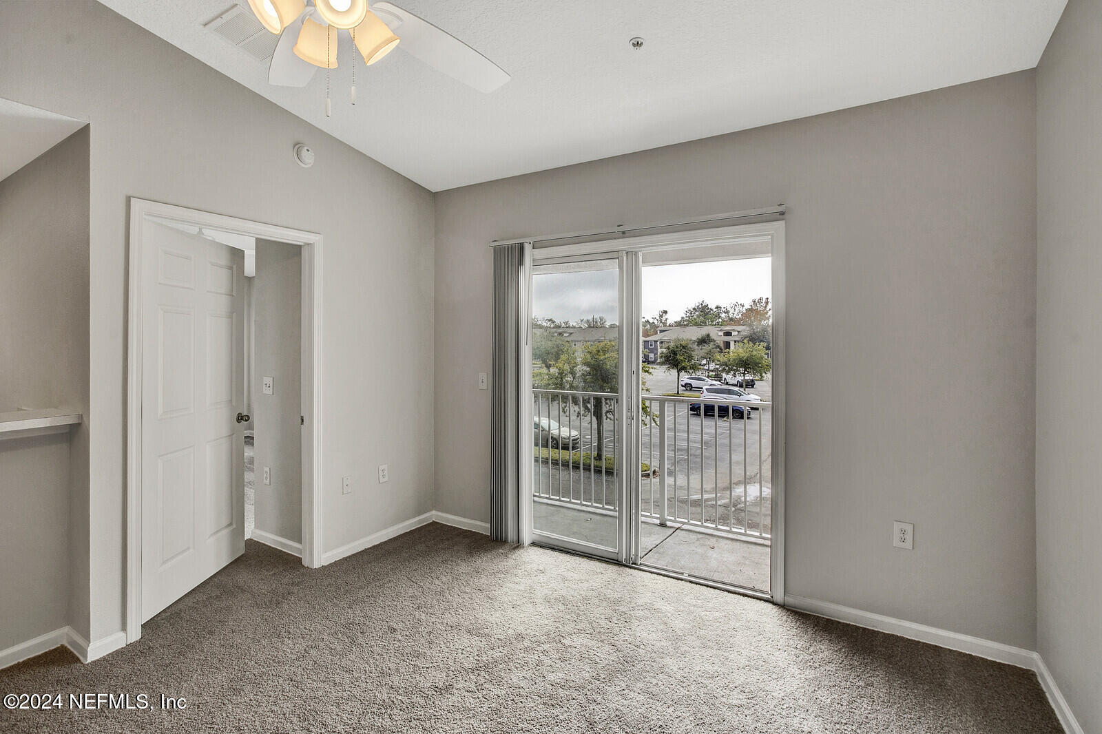 7920 Merrill Road, Unit 1411 Jacksonville, FL 32277 - Photo 14 of 18 a view of an empty room with a window