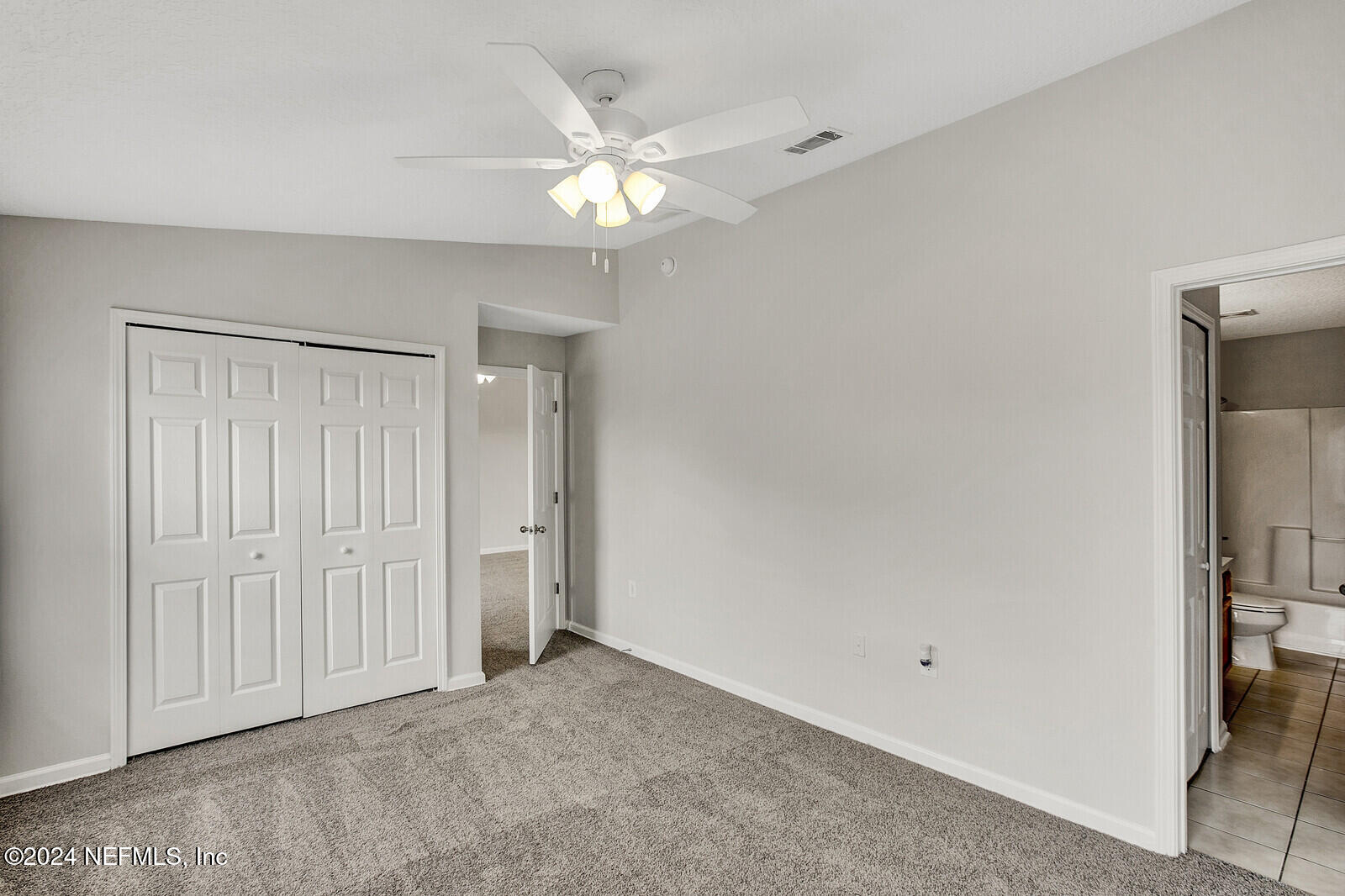 7920 Merrill Road, Unit 1411 Jacksonville, FL 32277 - Photo 8 of 18 wooden floor in an empty room