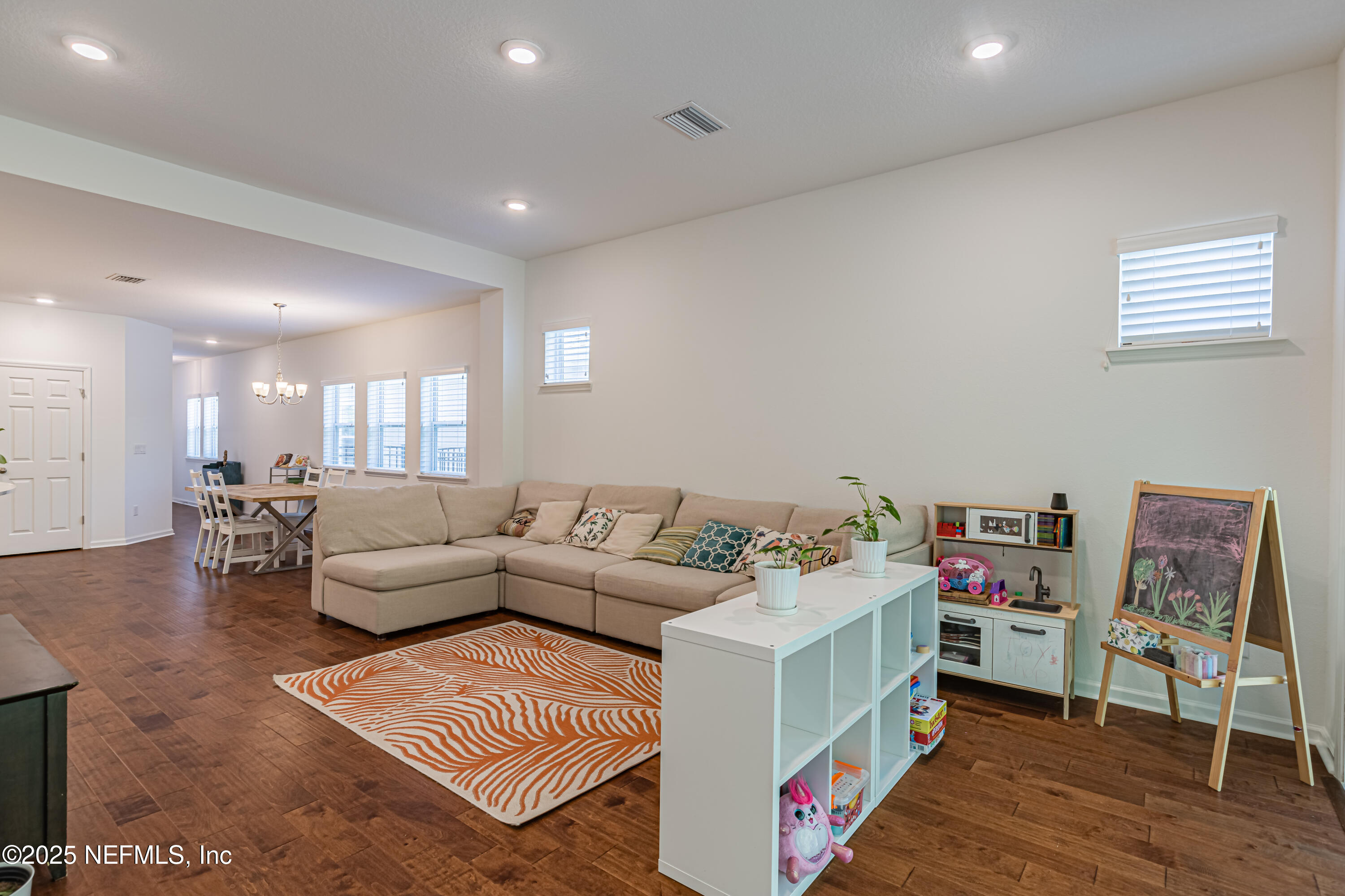 383 Windswept Way Street St. Augustine, FL 32092 - Photo 19 of 34 a living room with furniture and a wooden floor