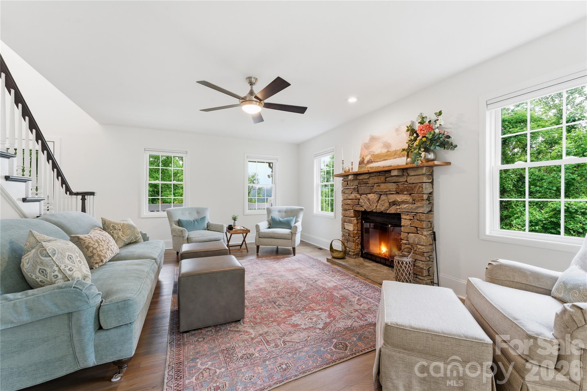 15 Raccoon Point Canton, NC 28716 - Photo 12 of 48 a living room with furniture a window and a fireplace
