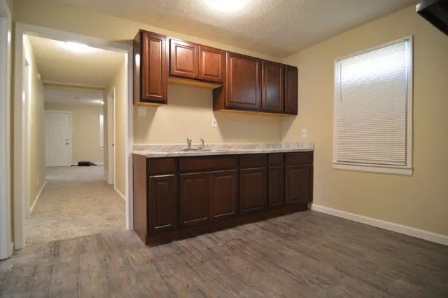 a view of kitchen with wooden floor