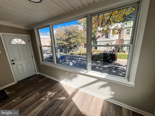 a view of a living room and a floor to ceiling window