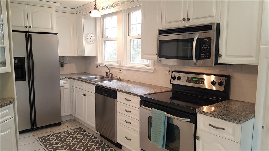 1 Penhurst Road Ben Avon Heights, PA 15202 - Photo 11 of 25 Pseudo galley kitchen opens up into morning room eat-in breakfast area that includes an extra appliance refinished cabinet!