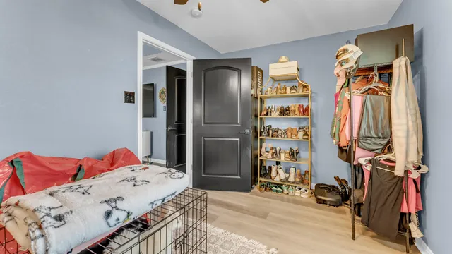 a bedroom with a bed and a closet