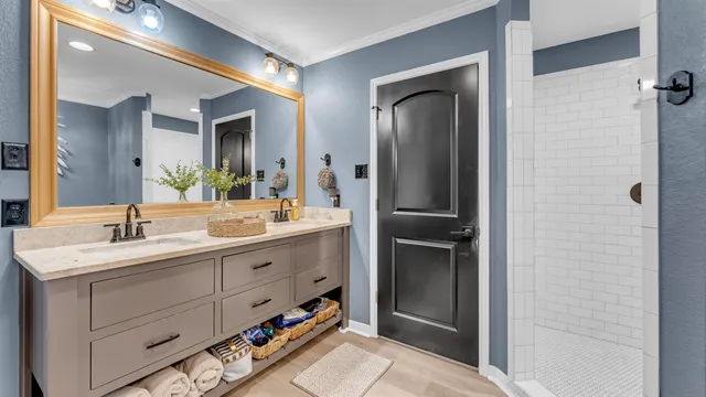 a bathroom with a double vanity sink and mirror