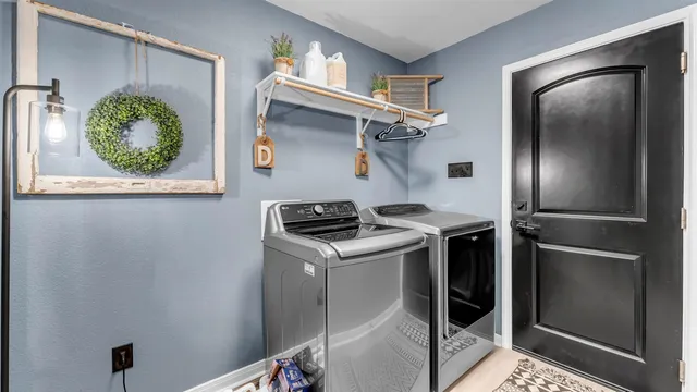 a kitchen with stainless steel appliances granite countertop a refrigerator and a stove