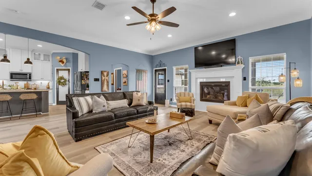 a living room with furniture fireplace and a flat screen tv