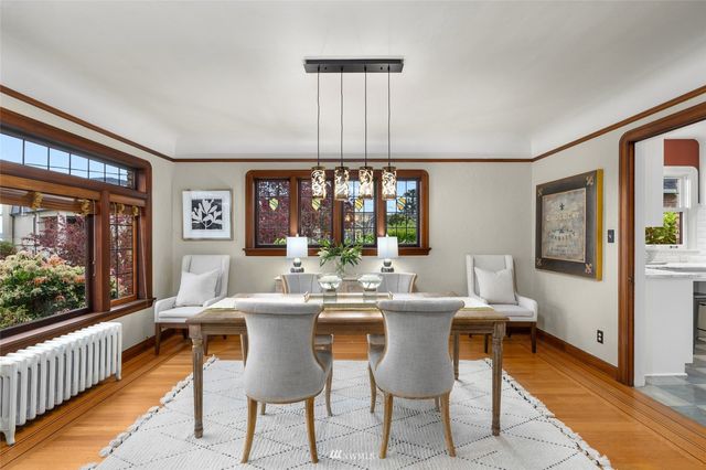 a dinning table and chairs in a kitchen