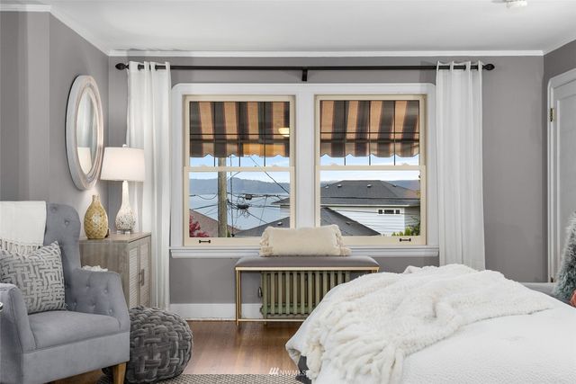 a bathroom with a granite countertop sink a mirror and a shower
