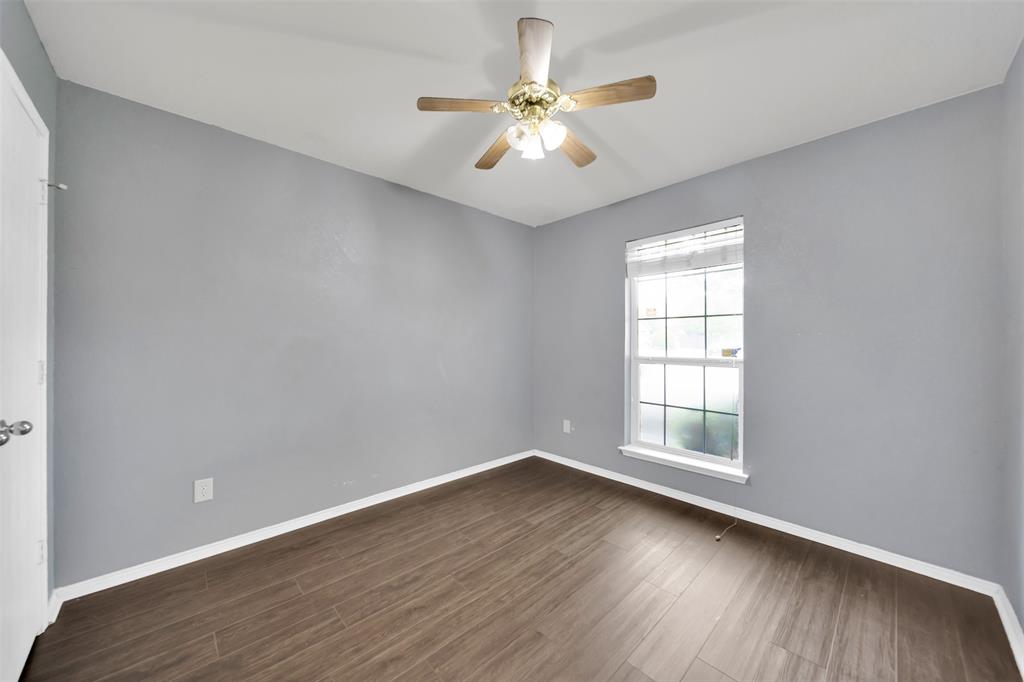 4221 Fiste Denton, TX 76207 - Photo 17 of 26 Spare room with ceiling fan and dark hardwood / wood-style flooring