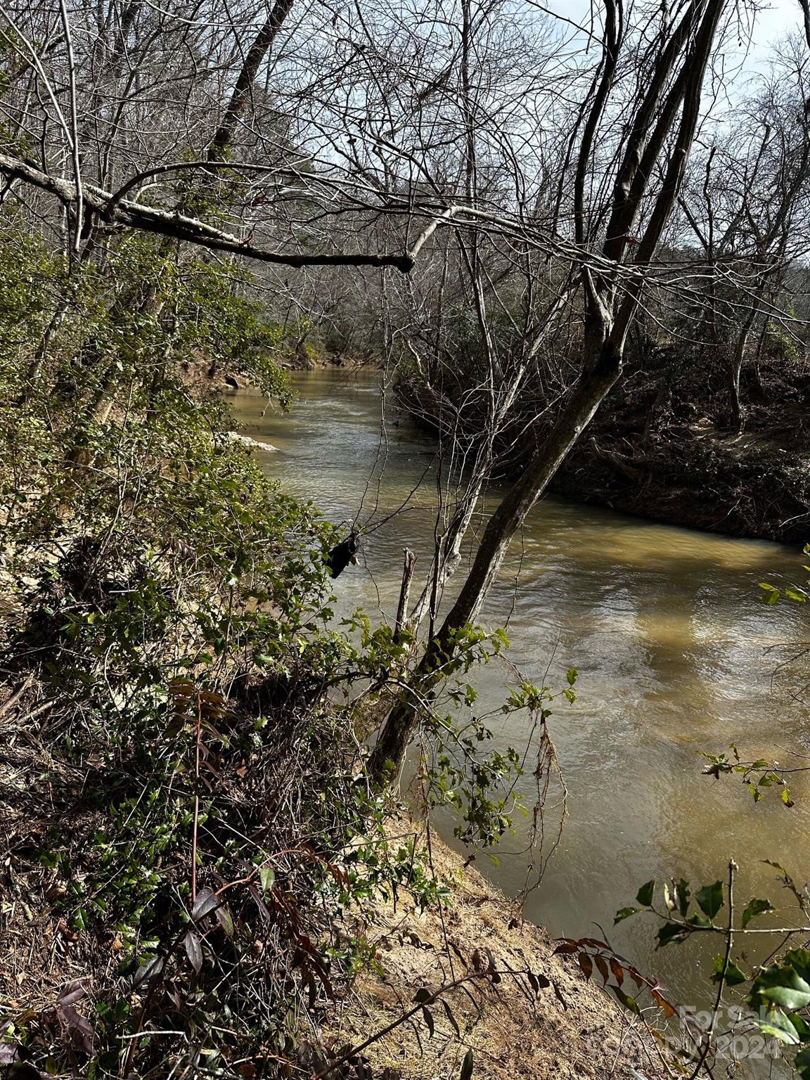 408-410 Huckleberry Ridge Road Hiddenite, NC 28636 - Photo 1 of 11 a view of a lake