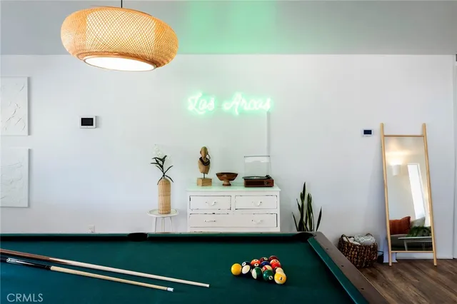 a living room with furniture a table and a flat screen tv