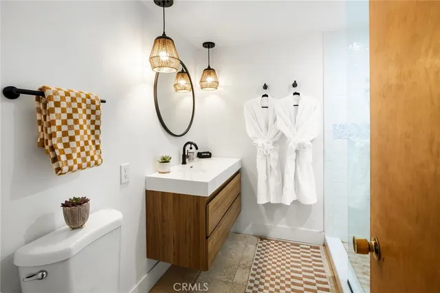 a view of a patio with table and chairs and potted plants