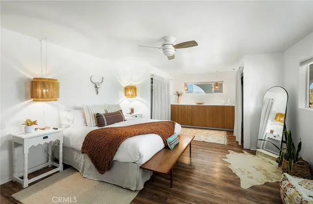 a view of a swimming pool with a table and chairs