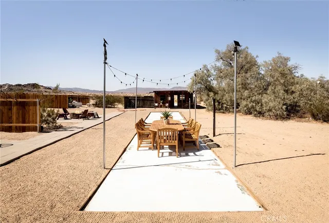 a view of a chairs and tables in a patio