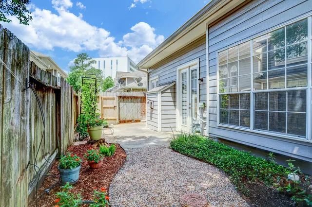 a living room filled with furniture and a potted plant